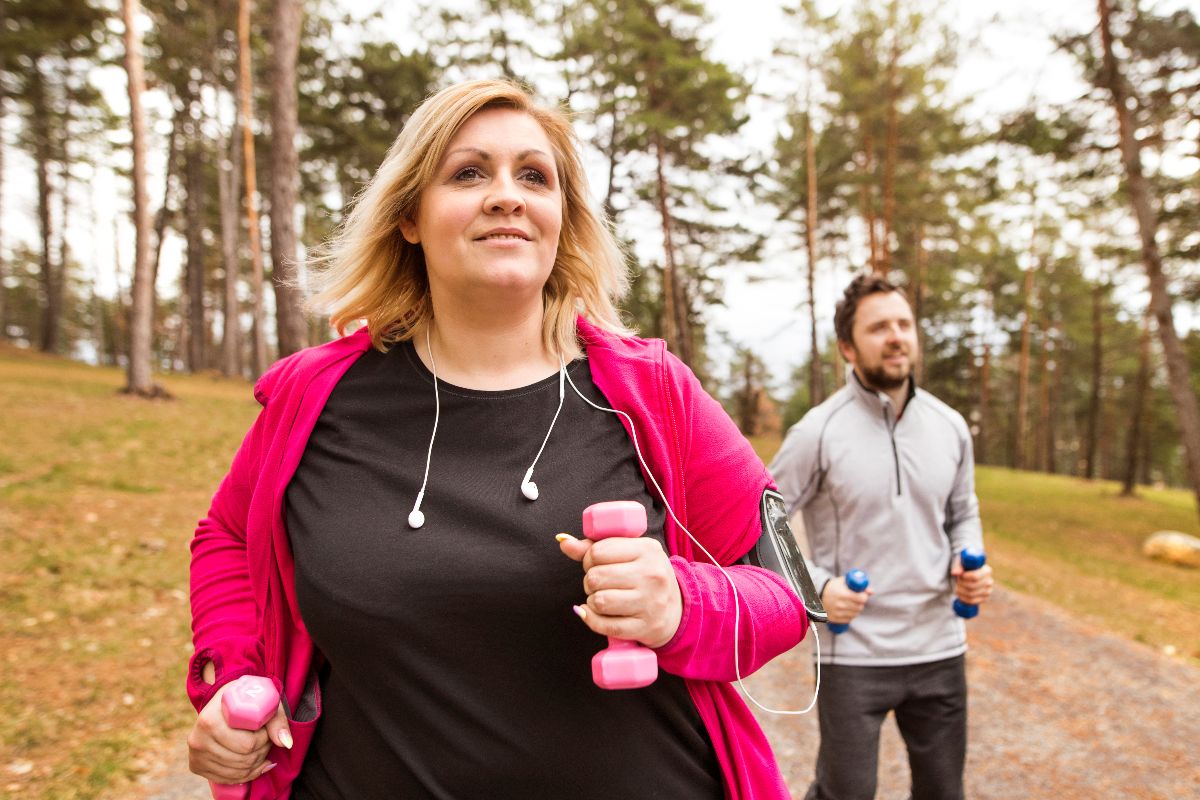 bhh-nov-25-02 Person walking outdoors for daily exercise while participating in a medical weight loss program with GLP-1 support.