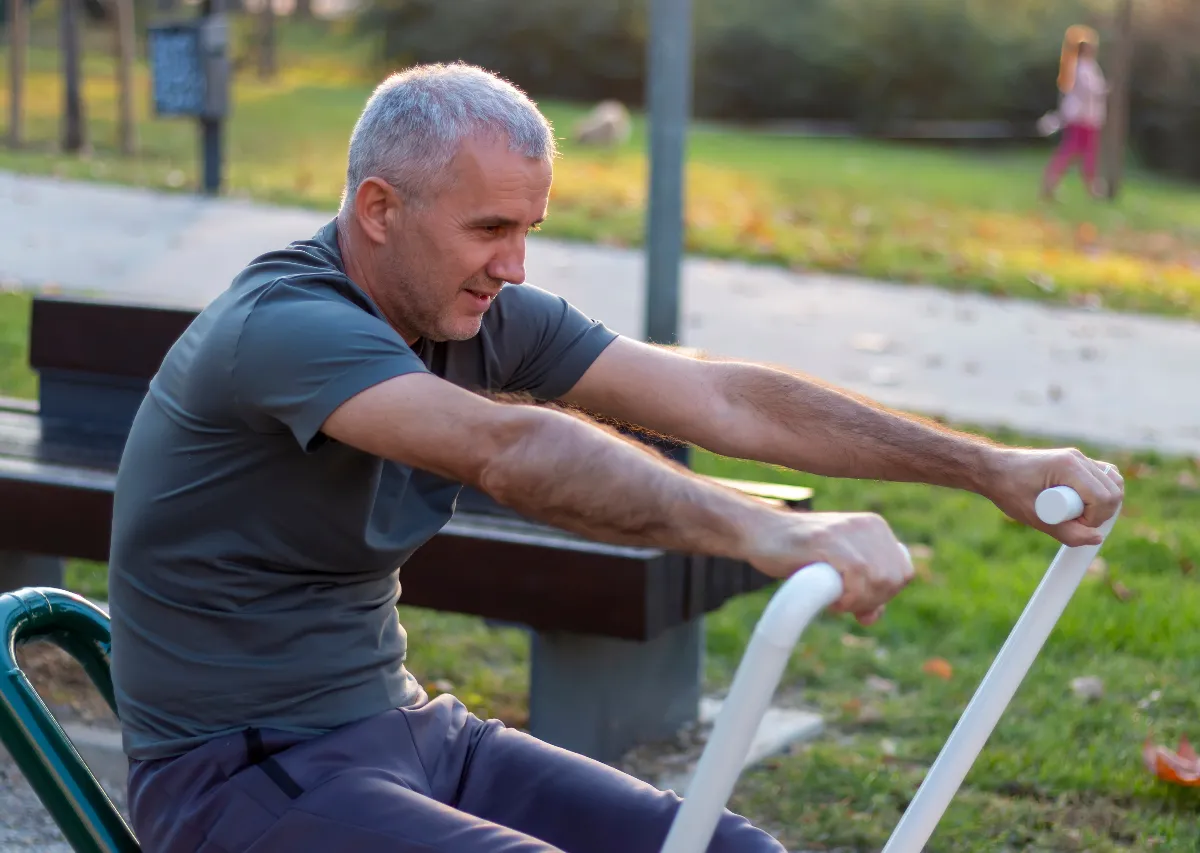 Man exercising outdoors in a park during a spring reset weight loss routine to restart weight loss progress in March.